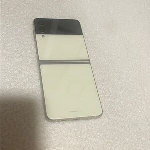 Samsung Cream and Black Flip Phone